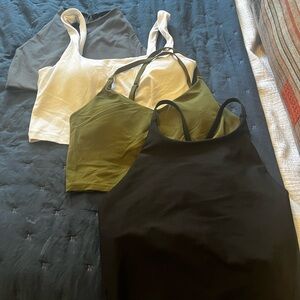 Set of Four Bra Tanks - Old Navy, Athleta, and Girlfriend Collective.